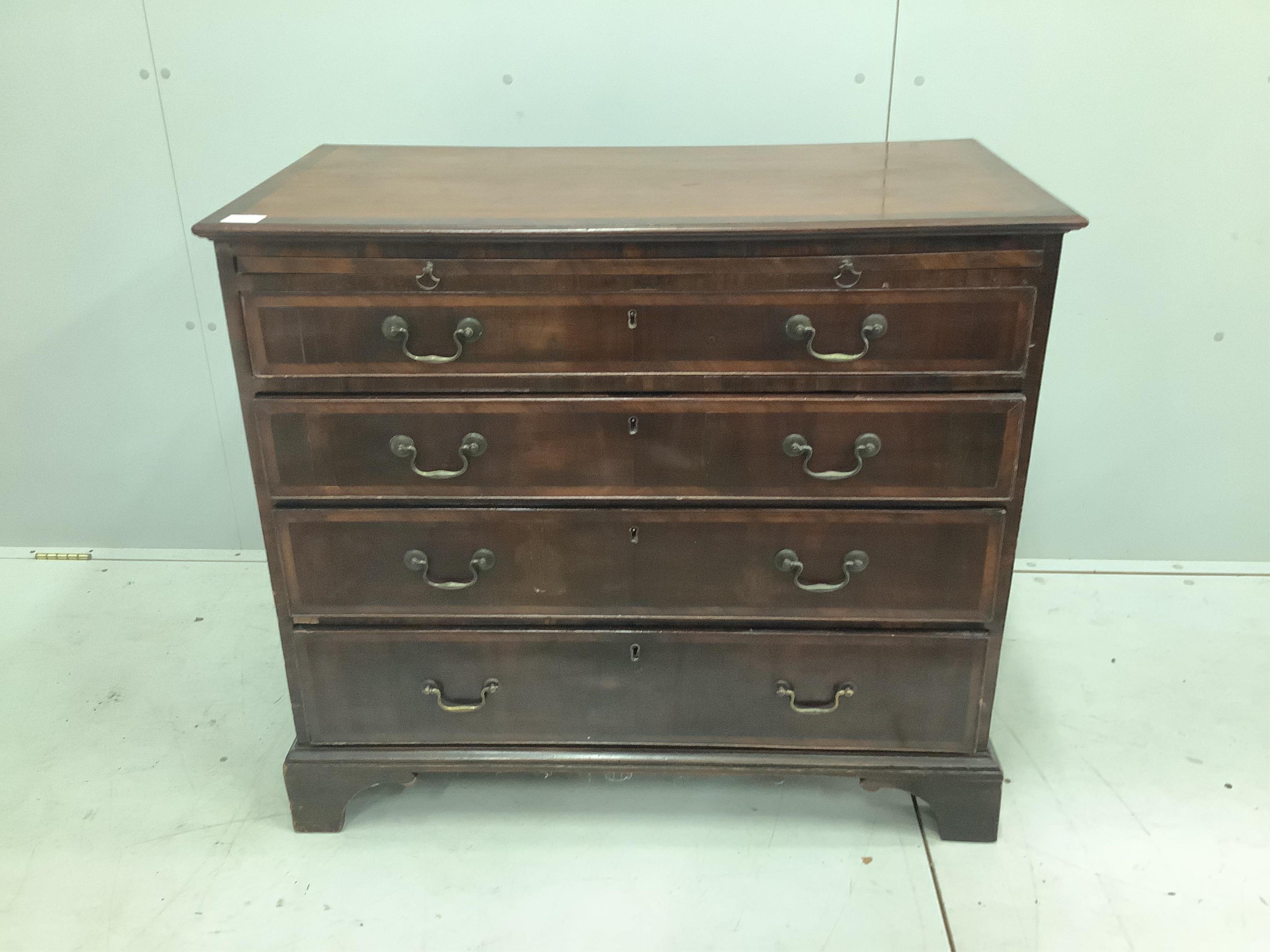 A small George III mahogany chest of four drawers with brushing slide, width 94cm, depth 49cm, height 84cm. Condition - fair